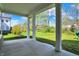 Covered back porch with concrete flooring, offering a relaxing outdoor space with a backyard view at 14349 Marsdale Pl, Carmel, IN 46074