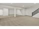 Large unfinished basement with neutral carpet and recessed lighting, offering flexibility for customization at 14349 Marsdale Pl, Carmel, IN 46074