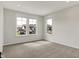 Bright bedroom with three windows offering abundant natural light and serene views of the neighborhood at 14349 Marsdale Pl, Carmel, IN 46074