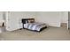 Spacious bedroom featuring plush carpeting, stylish furnishings, and an adjacent ensuite bathroom at 14349 Marsdale Pl, Carmel, IN 46074