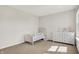 Bedroom or bedroom with a toddler bed, dresser, and bright, natural light at 14349 Marsdale Pl, Carmel, IN 46074