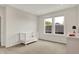 Bedroom or bedroom featuring a crib and dresser with natural light from the windows at 14349 Marsdale Pl, Carmel, IN 46074