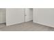 Bedroom features neutral walls and carpet, with door to closet at 14349 Marsdale Pl, Carmel, IN 46074