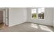 Bright bedroom with a window offering natural light and serene views of the neighborhood at 14349 Marsdale Pl, Carmel, IN 46074