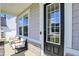 Close-up of the front door with a sidelight, featuring a modern design and convenient keyless entry at 14349 Marsdale Pl, Carmel, IN 46074