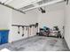 Spacious garage featuring organized storage for tools and a recycling bin at 14349 Marsdale Pl, Carmel, IN 46074