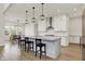 Bright kitchen with a granite island, stainless steel appliances, and an eat-in dining area at 14349 Marsdale Pl, Carmel, IN 46074