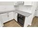 Kitchen area features a wine fridge, granite countertops, and lots of cabinet space at 14349 Marsdale Pl, Carmel, IN 46074