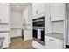 Kitchen area features stainless steel appliances, wine rack and granite countertops at 14349 Marsdale Pl, Carmel, IN 46074