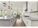 Beautiful kitchen with center island, pendant lighting, stainless steel hood, and eat in dining area at 14349 Marsdale Pl, Carmel, IN 46074