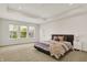 Spacious main bedroom featuring large windows, a cozy bed, and a serene atmosphere at 14349 Marsdale Pl, Carmel, IN 46074