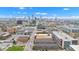 An aerial view captures a red brick apartment complex with the city skyline in the background at 1476 N Illinois St, Indianapolis, IN 46202