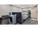 Finished basement space with a built in bed, desk, television and vinyl flooring at 1476 N Illinois St, Indianapolis, IN 46202
