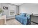 Small bedroom features a daybed, soft colors, and natural light from a window at 1476 N Illinois St, Indianapolis, IN 46202