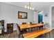 Inviting dining room featuring wood table, bench, stylish seating, and a mirrored accent piece at 1476 N Illinois St, Indianapolis, IN 46202