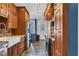 Spacious kitchen featuring wooden cabinetry, stainless steel appliances, and durable flooring at 1476 N Illinois St, Indianapolis, IN 46202