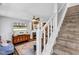 Cozy living room with a fireplace, decorative brick, modern decor, and a staircase at 1476 N Illinois St, Indianapolis, IN 46202