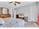 Bright bedroom with a large bed, ceiling fan, and plenty of natural light at 1476 N Illinois St, Indianapolis, IN 46202