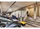 View of a multi-car parking garage showing car spaces and access to the stairs at 1476 N Illinois St, Indianapolis, IN 46202