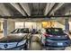 Parking garage showing two car spaces and a storage space with various items stored at 1476 N Illinois St, Indianapolis, IN 46202