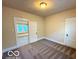 Bedroom featuring neutral walls, carpeted flooring, and natural light at 1510 W 22Nd St, Indianapolis, IN 46202