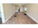 Spacious living room boasts new wood-look flooring and natural light at 1510 W 22Nd St, Indianapolis, IN 46202