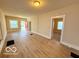 Open living area featuring stylish wood-look flooring, natural light, and neutral paint at 1510 W 22Nd St, Indianapolis, IN 46202