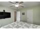 Spacious bedroom featuring a ceiling fan, a mounted TV, and neutral-toned walls at 1910 Riverstone Ct, Westfield, IN 46074