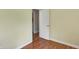 Empty bedroom with light wood floors and a white door at 1910 Riverstone Ct, Westfield, IN 46074