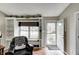 Inviting living room features an open entry door, built-in shelving and a comfortable reading nook at 1910 Riverstone Ct, Westfield, IN 46074