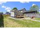 Expansive backyard featuring a deck, fire pit and ample green space at 2005 Carrollton Ave, Indianapolis, IN 46202