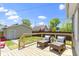 Outdoor deck featuring comfortable seating, a grassy yard, and beautiful sky at 2005 Carrollton Ave, Indianapolis, IN 46202