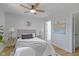 Comfortable bedroom features a ceiling fan, soft gray accents, and bright natural light at 2005 Carrollton Ave, Indianapolis, IN 46202