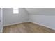 Bright bedroom showcasing hardwood floors and neutral paint colors throughout at 2005 Carrollton Ave, Indianapolis, IN 46202