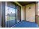 Cozy private balcony with sliding glass doors offering an outdoor retreat and a glimpse of the surrounding landscape at 2141 Rome Dr # Apt B, Indianapolis, IN 46228