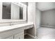 Bathroom vanity with carpeted bedroom in the background at 2141 Rome Dr # Apt B, Indianapolis, IN 46228