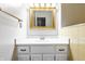 Bathroom vanity featuring a white sink and cabinet with a golden framed mirror, ready for your personal touch at 2141 Rome Dr # Apt B, Indianapolis, IN 46228