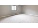 A sunlit bedroom featuring neutral carpet and gray walls, ready for personal touches and design inspiration at 2141 Rome Dr # Apt B, Indianapolis, IN 46228