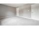 A spacious bedroom with light gray walls and neutral carpeting providing a calming, move-in-ready atmosphere at 2141 Rome Dr # Apt B, Indianapolis, IN 46228