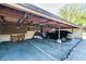 Carport with parking, firewood, and motorcycle storage, providing ample covered space for vehicles and outdoor equipment at 2141 Rome Dr # Apt B, Indianapolis, IN 46228