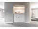 A peek into the kitchen with white cabinets, view from the living room at 2141 Rome Dr # Apt B, Indianapolis, IN 46228