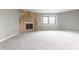 Bright and spacious living room with neutral carpet, fireplace and large windows at 2141 Rome Dr # Apt B, Indianapolis, IN 46228