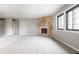 Open concept living room featuring neutral walls, carpet, and a fireplace at 2141 Rome Dr # Apt B, Indianapolis, IN 46228