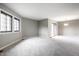Bright living room with sliding glass doors to patio and a pendant light at 2141 Rome Dr # Apt B, Indianapolis, IN 46228