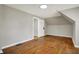 Bedroom featuring hardwood floors, neutral walls, and a view to an adjacent room at 222 Raines St, Plainfield, IN 46168