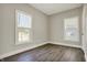 Bright bedroom featuring dual windows and neutral paint at 222 Raines St, Plainfield, IN 46168