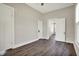 Empty bedroom with wood floors, white trim, and natural light at 222 Raines St, Plainfield, IN 46168