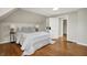 Bedroom featuring sloped ceilings, hardwood floors, a queen size bed, and interior door at 222 Raines St, Plainfield, IN 46168