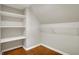 Walk-in closet with built-in shelving, hardwood floors, and ample storage space at 222 Raines St, Plainfield, IN 46168