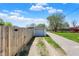 A detached garage at the end of a long driveway, nestled in a serene backyard setting, providing ample parking at 222 Raines St, Plainfield, IN 46168
